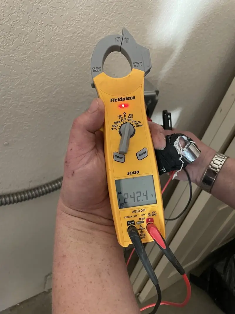 Voltage testing with clamp meter during Generator Installation in Orchard Homes